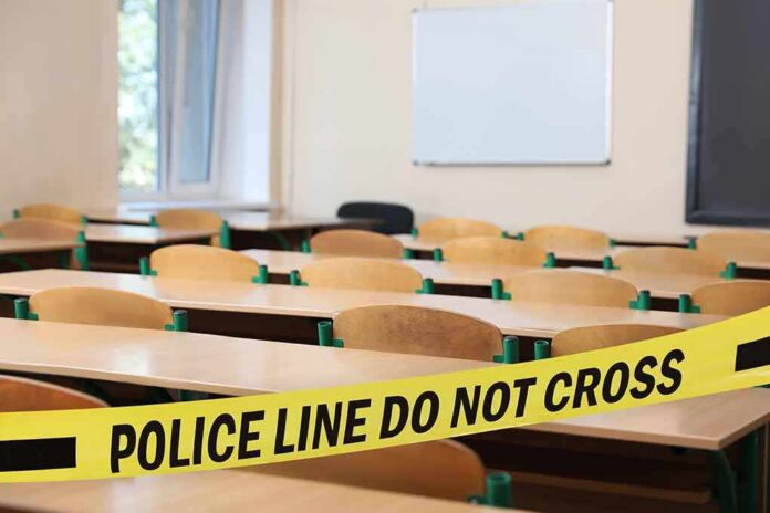 Empty classroom with police tape across desks