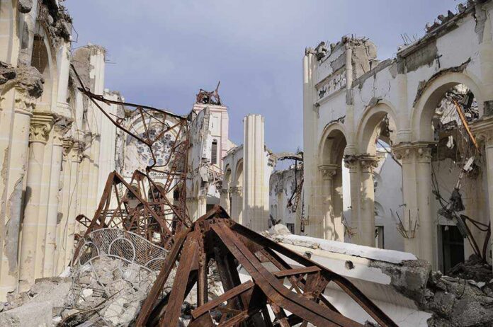Interior view of a destroyed building with collapsed arches and debris