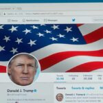computer screen showing a social media profile with an american flag banner