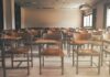 Footage of 6-Year-Old After He Shot His Teacher Empty classroom with rows of wooden desks and chairs