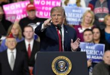 Trump Opens Tax-Free Diesel to Highway Drivers Donald Trump speaking at a rally podium, pointing toward the audience