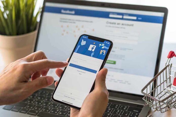 Hands using a smartphone with a social media login screen