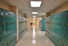 School hallway with rows of teal lockers