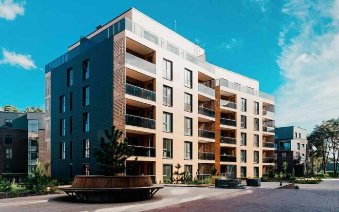 Modern apartment building with balconies in a landscaped courtyard