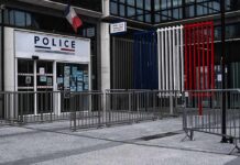 Man Charged With Rape Could Become Police Chief Police station entrance with barriers and French flag colors