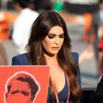 Kimberly Guilfoyle walking outdoors among a crowd