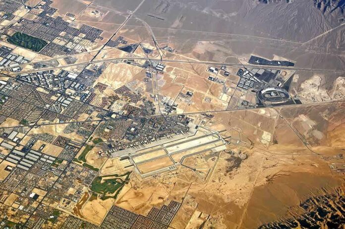 Aerial view of desert city with airport and highways