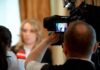 $4M Mom Bomb Rocks Governor Race tv camera films interview with blurred speaker
